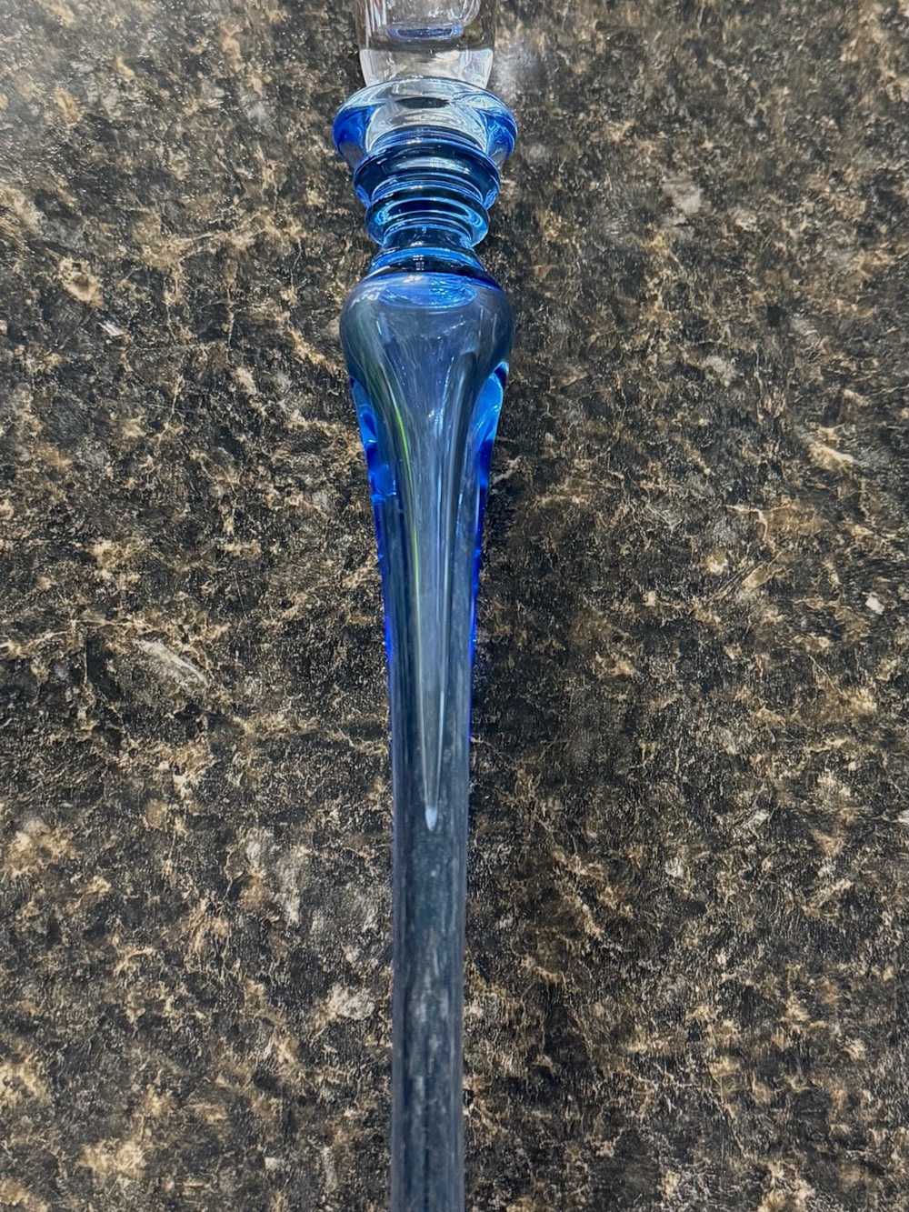 Blue crystal candle holder with a distinctive blue stem.